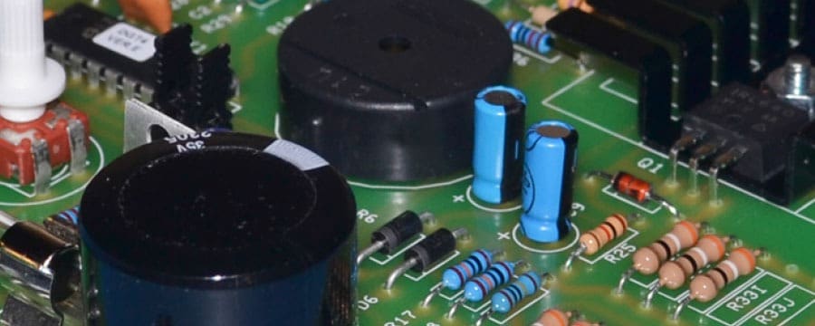 Through-hole components soldered on a printed circuit board assembled at GC Controls